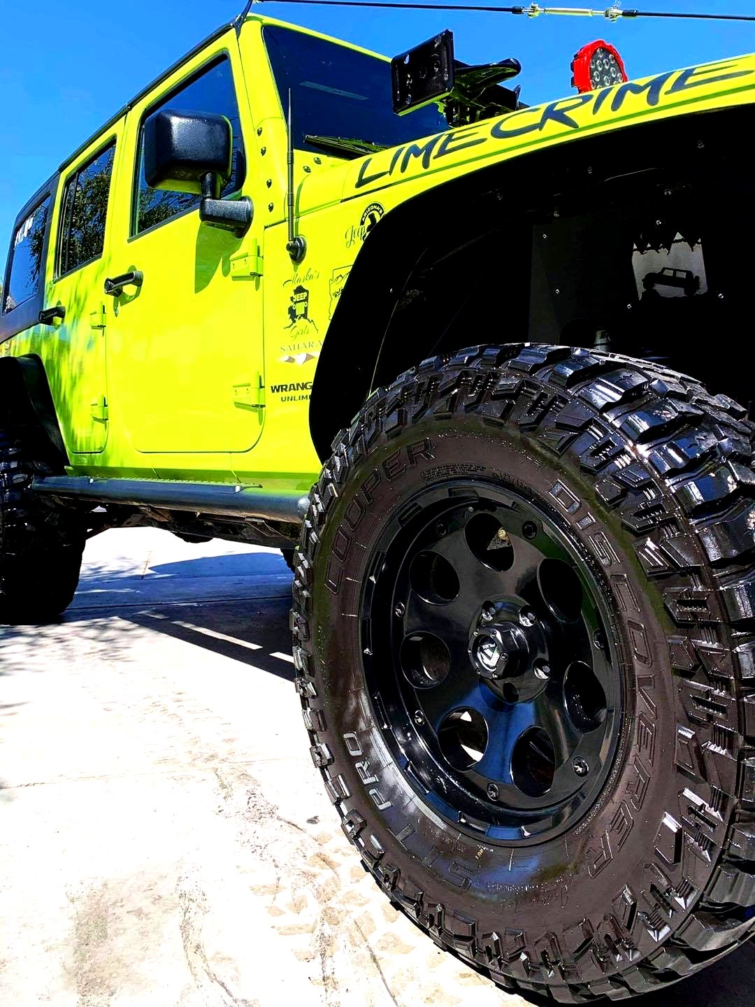 Lime green Jeep Wrangler detail — Carvocity